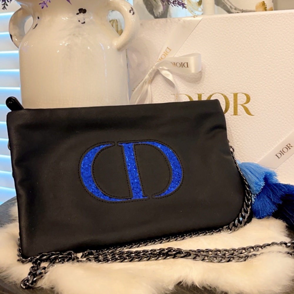 Dior crossbody with black chain and decorative tassels with keychain.